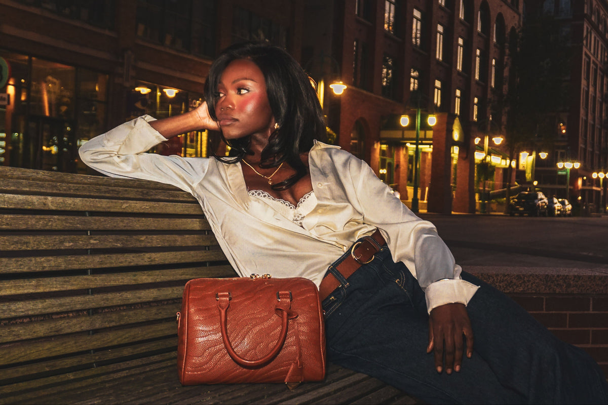 Model styling the KIOR Lilac Cloud Boston bag